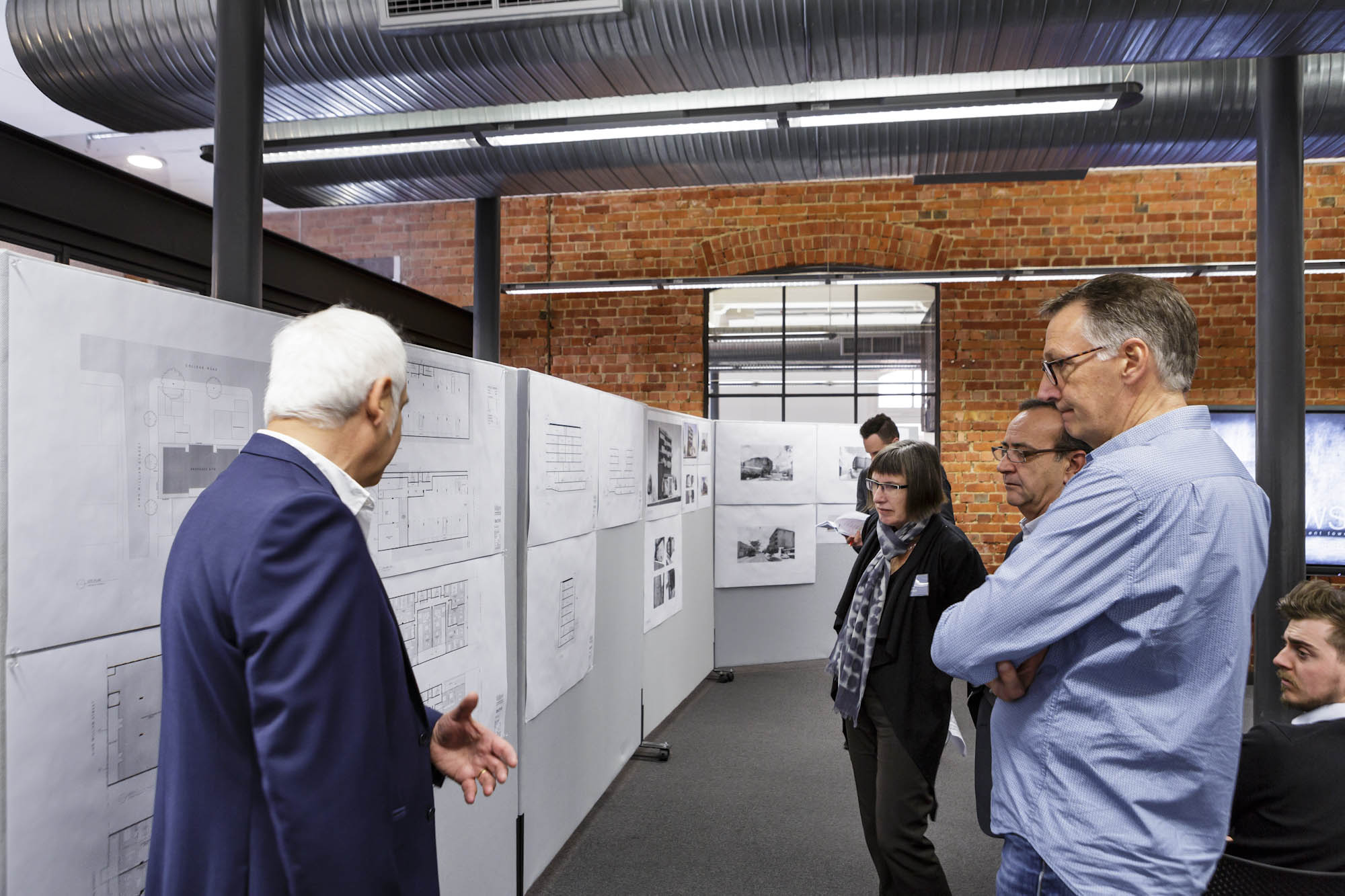 Design Review Panel members reviewing architectural drawings